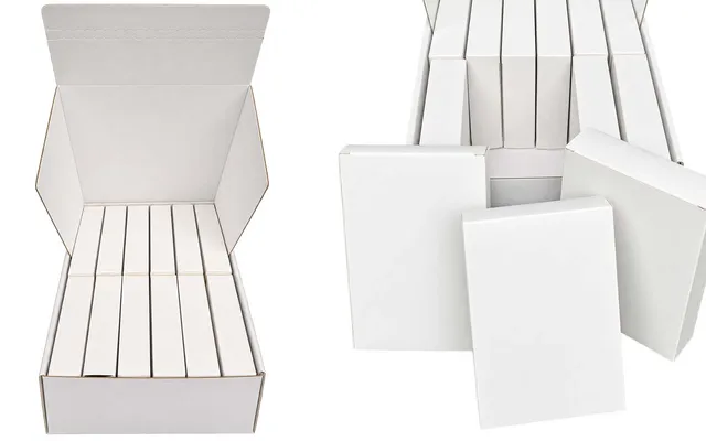An open white outer calendar box holding twelve inner tuck boxes, beside loose inner boxes ready to be filled