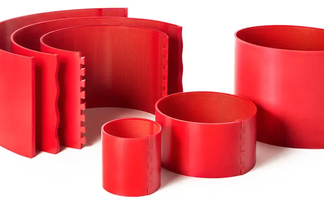 Red Policart urethane anvil covers in several diameters, showing their interlocking joints