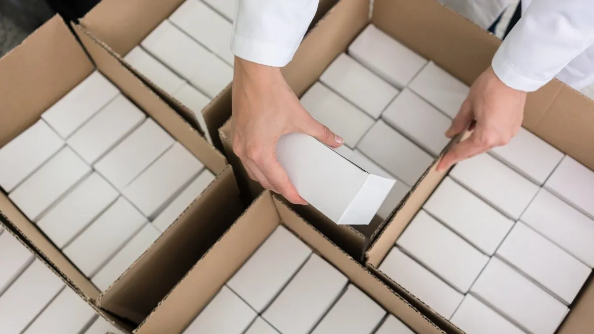 Cartons being packed into corrugated cases from an identical repeating specification