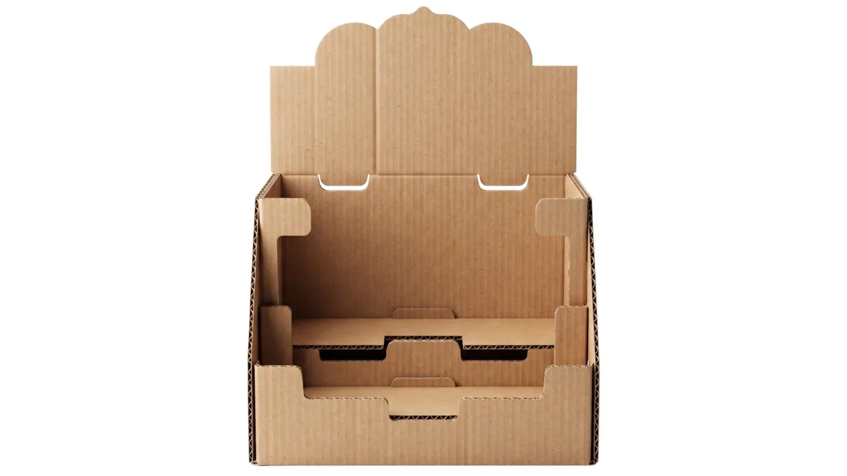A corrugated shelf ready display unit with a header card, a tear-away front and a stepped product tray
