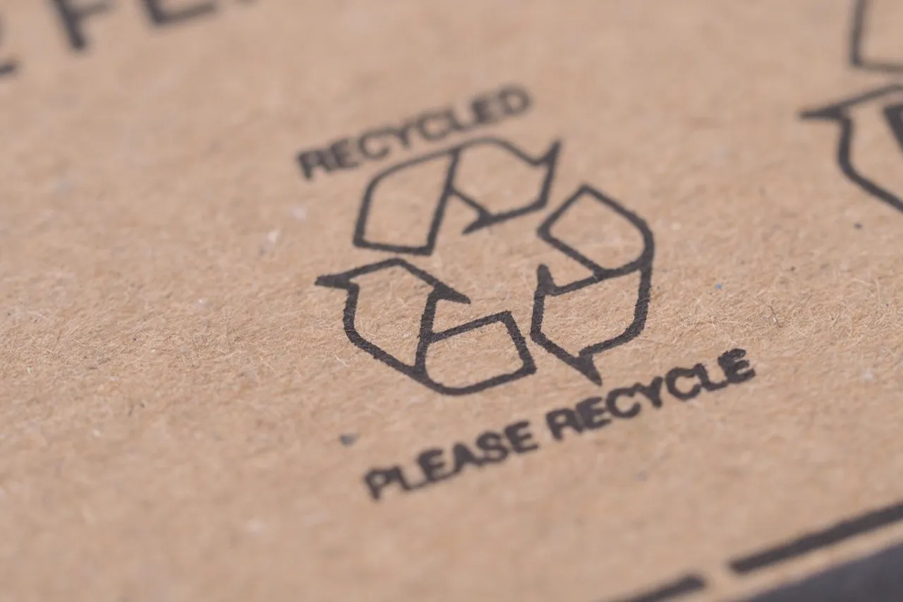 A close-up of black ink printed on kraft corrugated board